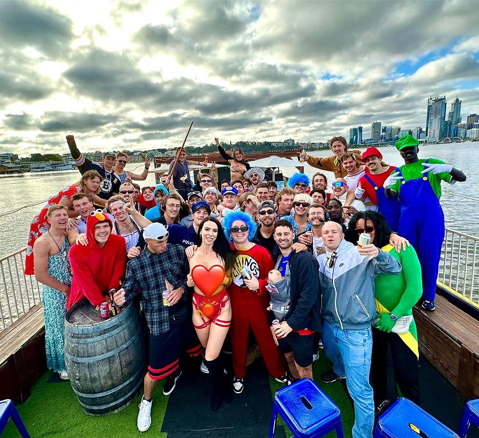 Topless waitress serving drinks on a Swan River boat charter